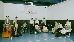 Seventeen K-Pop Group Members Posing in a Basketball Court Studio HD wallpaper