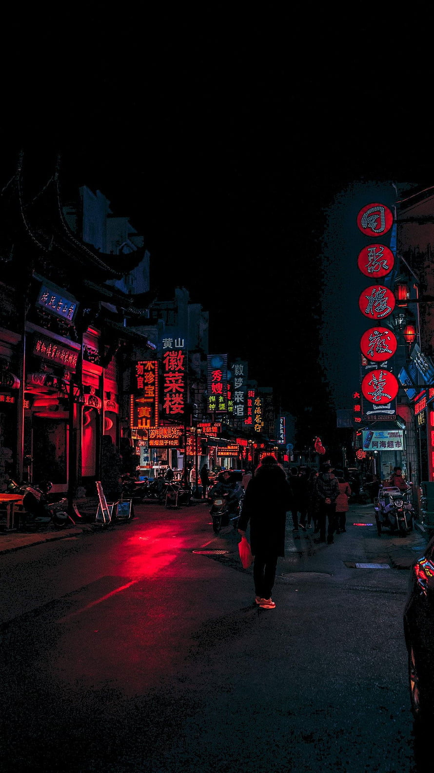 Neon-lit Chinese street at night with glowing red signs and pedestrians walking on wet pavement HD phone wallpaper