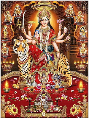 Goddess Durga Sitting on Tiger with Weapons and Divine Symbols HD phone wallpaper