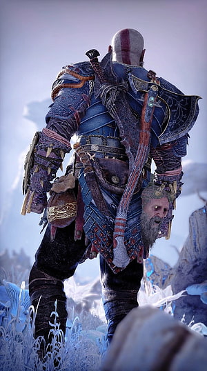 Kratos from God of War Ragnarok standing in a snowy landscape with Leviathan Axe on his back HD phone wallpaper