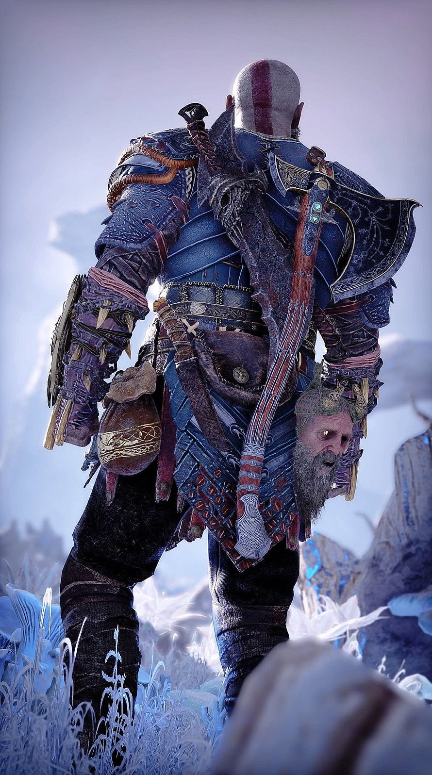Kratos from God of War Ragnarok standing in a snowy landscape with Leviathan Axe on his back HD phone wallpaper