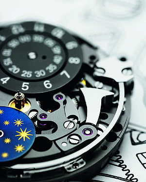 Intricate Mechanical Watch Movement with Celestial Star Disc and Precision Gears HD phone wallpaper