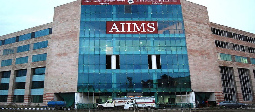 AIIMS Rishikesh Main Building Exterior with Blue Glass Facade HD wallpaper
