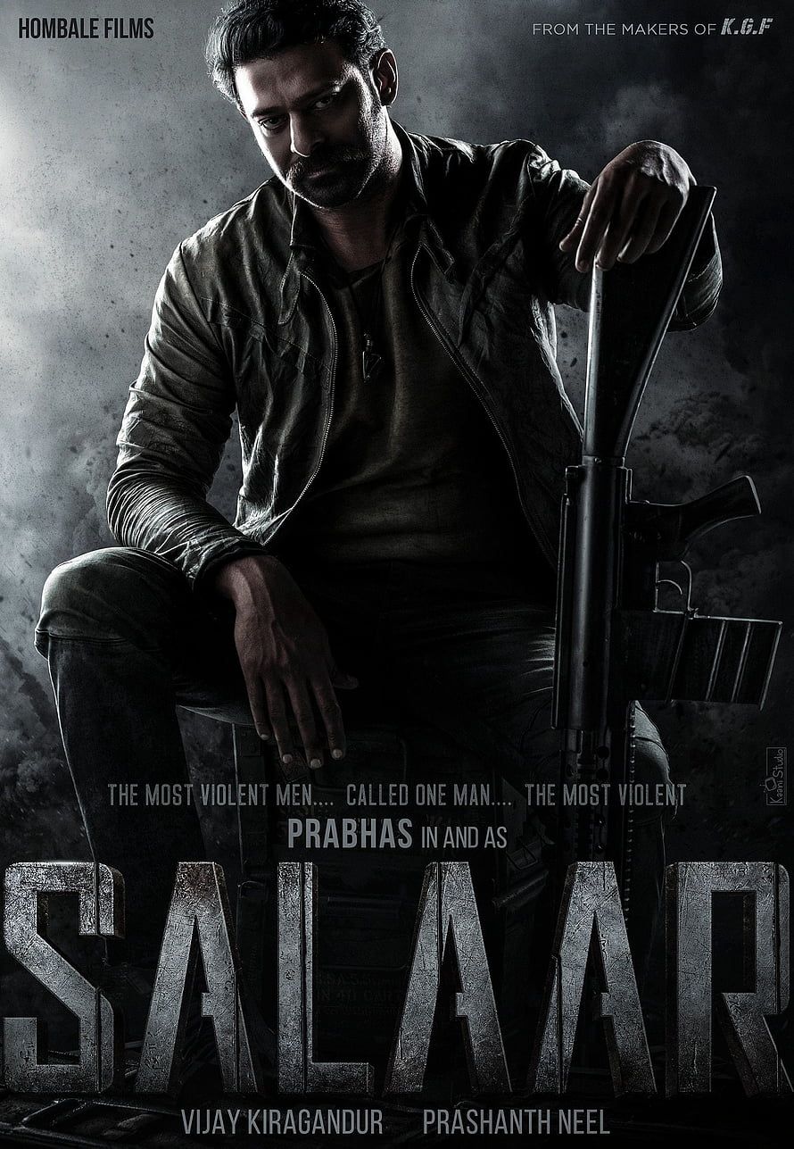 Prabhas as Salaar holding a rifle in a dark cinematic movie poster HD phone wallpaper