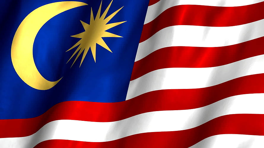 Malaysia National Flag Waving in Wind with Crescent Moon and Star HD wallpaper