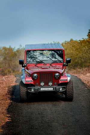 Red Mahindra Thar CRDi 4x4 Jeep Style Off-Road Vehicle on Gravel Trail HD phone wallpaper