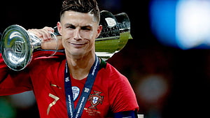 Cristiano Ronaldo Lifting the UEFA Nations League Trophy in Portugal Kit HD wallpaper
