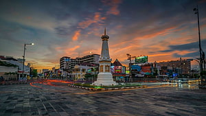Tugu Pal Putih Monument in Yogyakarta City Center at Sunset with Light Trails HD wallpaper