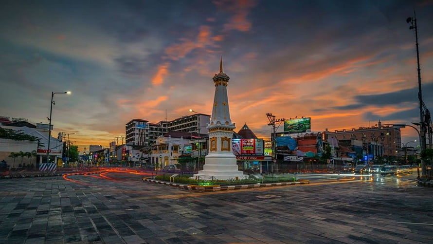Tugu Pal Putih Monument in Yogyakarta City Center at Sunset with Light Trails HD wallpaper