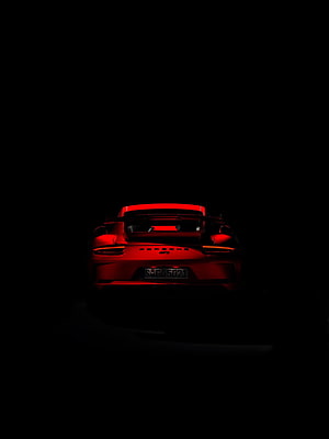 Rear View of a Red Porsche 911 GT3 in Dramatic Low-Key Lighting HD phone wallpaper