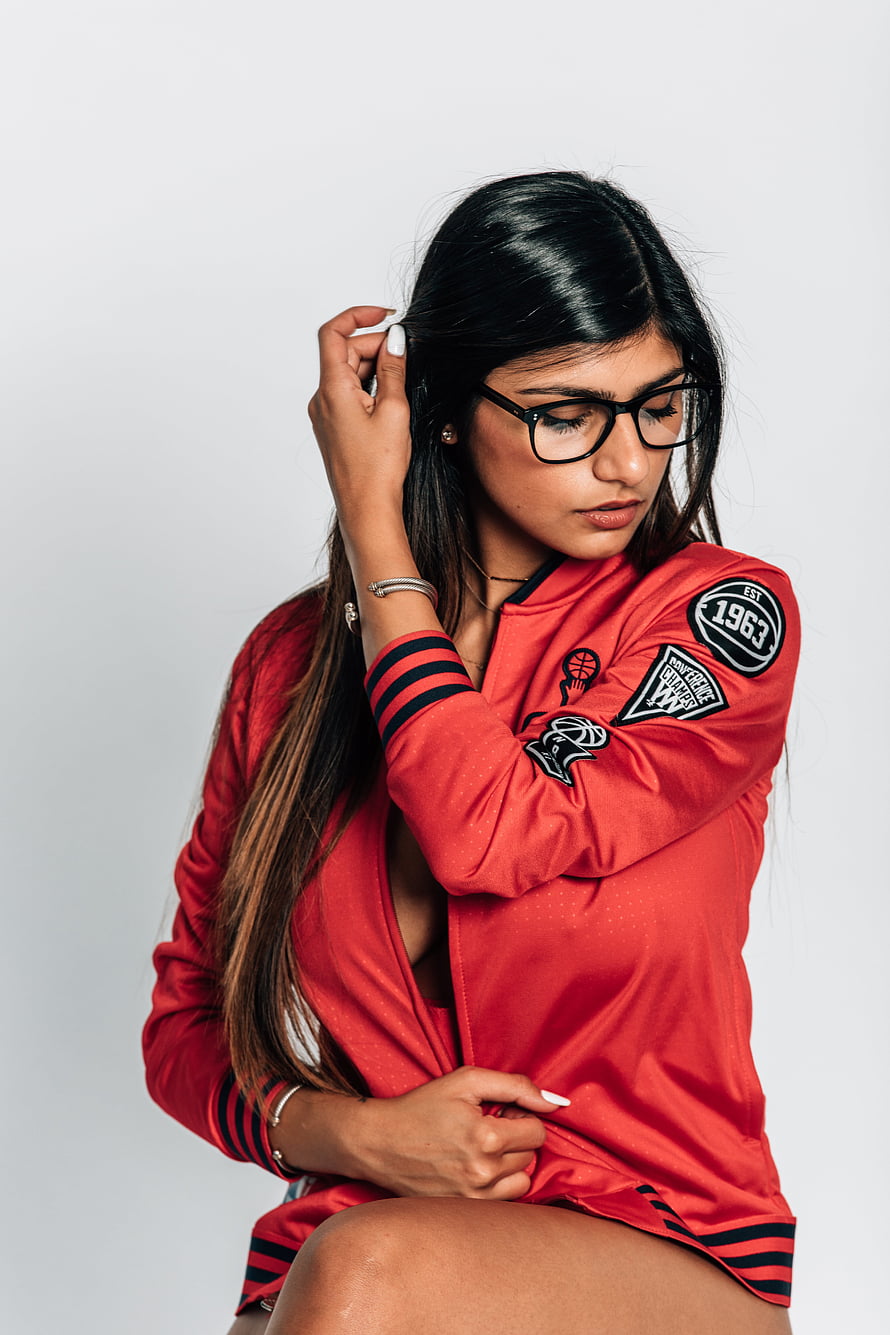 Woman in Red New York Knicks Jacket with Glasses and Long Dark Hair, Exclusive: Mia Khalifa Talks Twitch, John Wall All, #mia khalifa HD phone wallpaper