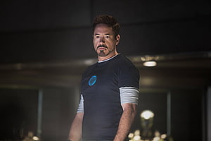 Tony Stark in Stark Industries T-Shirt in Dark Industrial Setting HD wallpaper