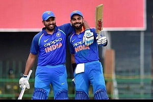Virat Kohli and Rohit Sharma Celebrate Partnership in India Cricket Uniforms HD wallpaper