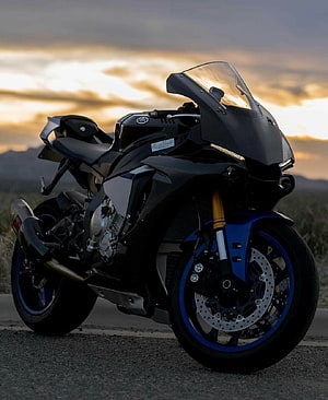 Yamaha R1M Superbike in Matte Black with Blue Accents at Sunset HD phone wallpaper