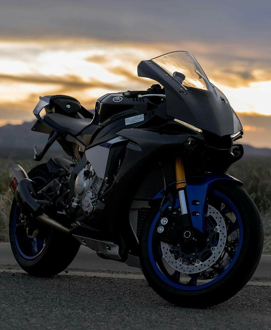 Yamaha R1M Superbike in Matte Black with Blue Accents at Sunset HD phone wallpaper