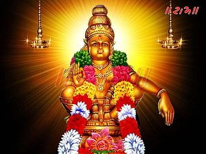 Ayyappa Swamy Golden Idol Adorned With Flower Garlands And Radiant Divine Light HD wallpaper