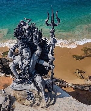 Shiva Nataraja Statue at Azhimala Beach in Kerala with Turquoise Ocean and Sandy Shore HD phone wallpaper