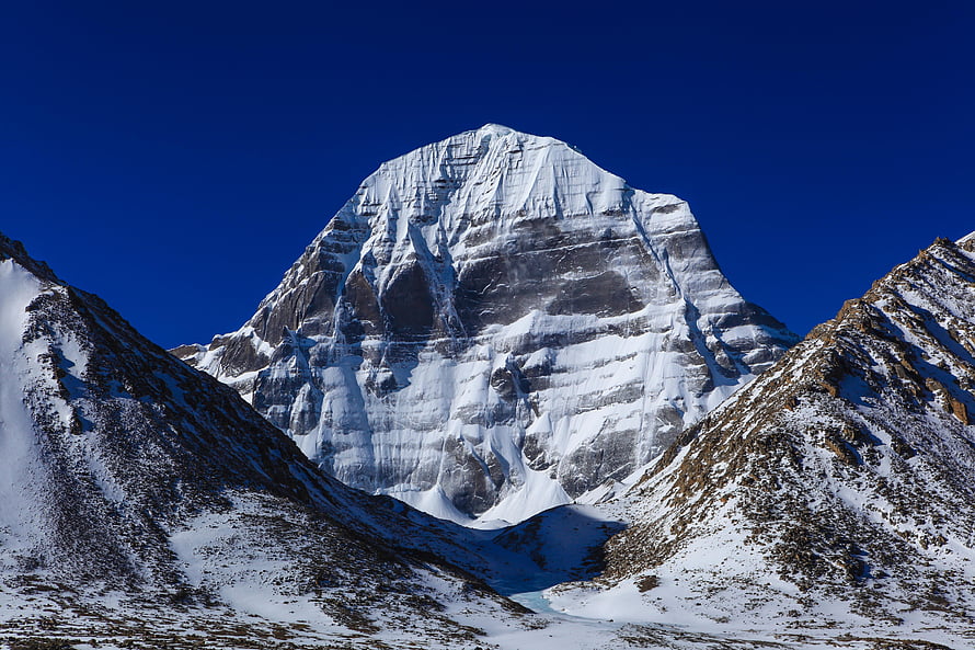 Mount Kailash Snow-Capped Peak in Tibet Under a Deep Blue Sky HD wallpaper