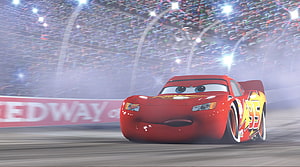 Lightning McQueen Racing on the Track in Cars Animated Movie Scene HD wallpaper