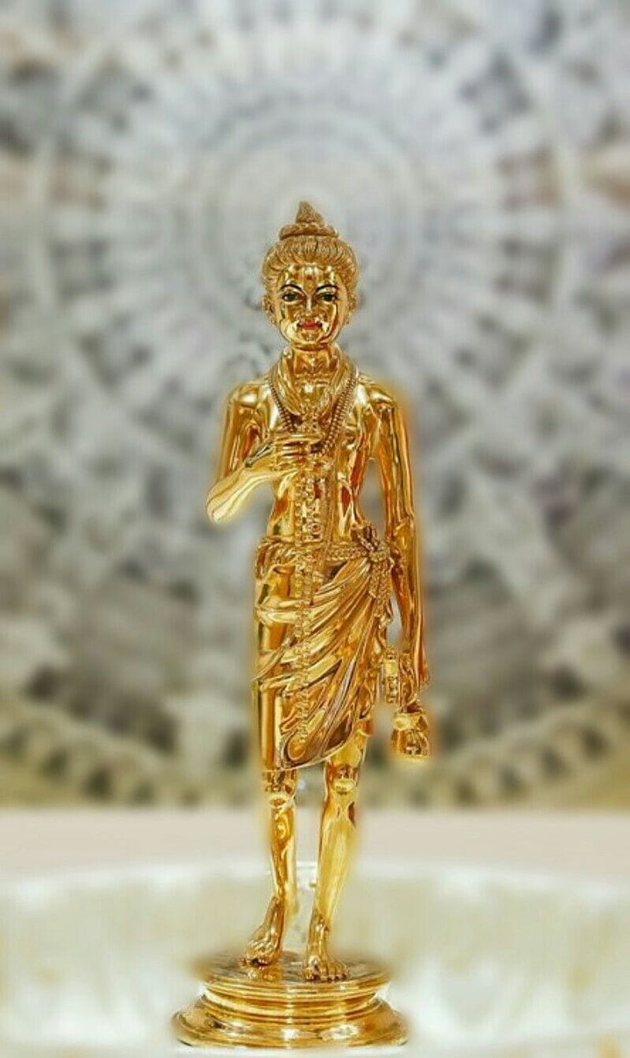Golden Nilkanth Standing Figure with Ornate Jewelry and Traditional Attire HD phone wallpaper