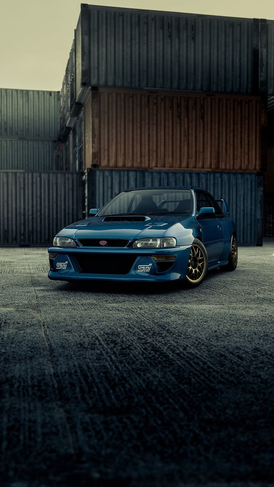 Blue Subaru Impreza 22B STI parked in front of stacked shipping containers HD phone wallpaper