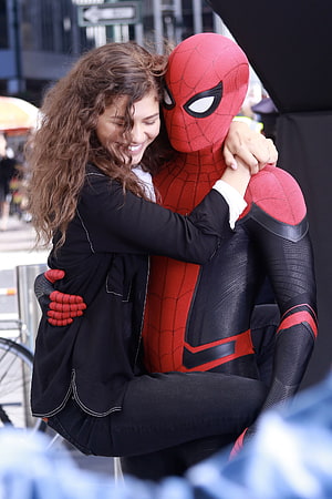 Zendaya and Spider-Man in a warm embrace on a city street, Fans Love Zendaya and Tom Holland's Chemistry in, peter parker and mj HD phone wallpaper