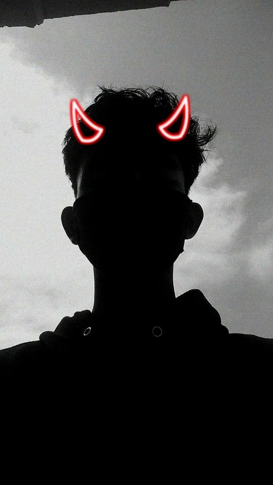 Silhouette Portrait With Glowing Red Devil Horns Against Overcast Sky HD phone wallpaper