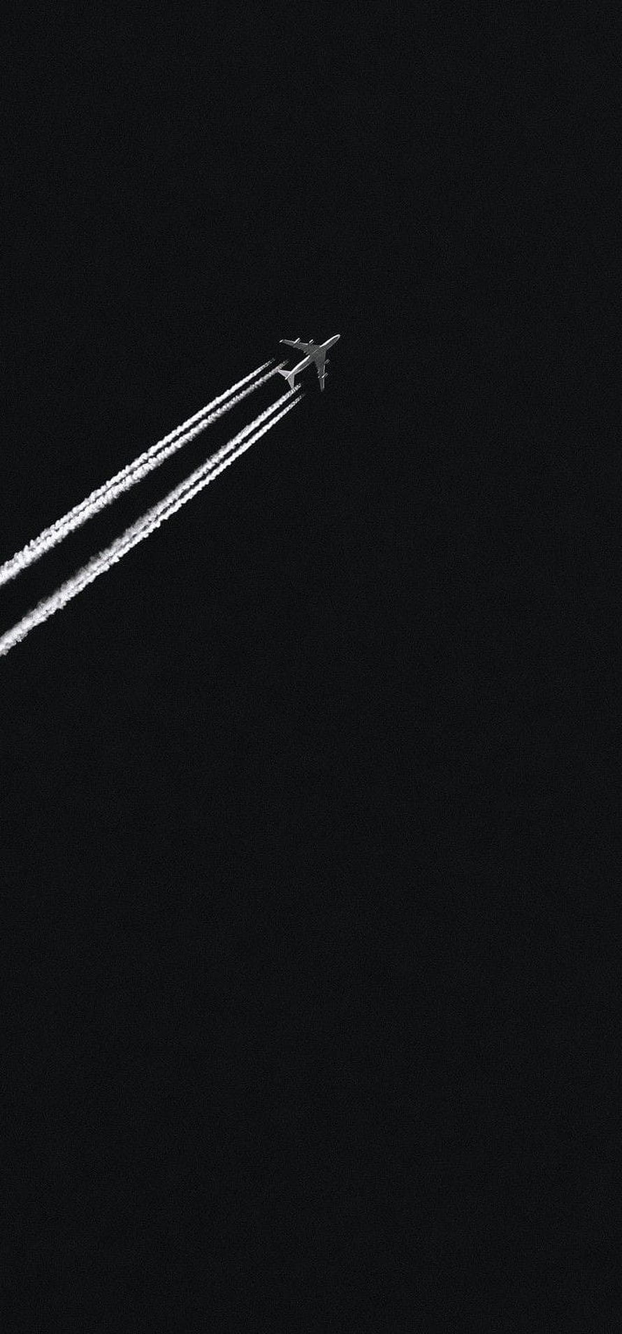Minimalist Airplane Silhouette with Contrails Against a Dark Night Sky HD phone wallpaper