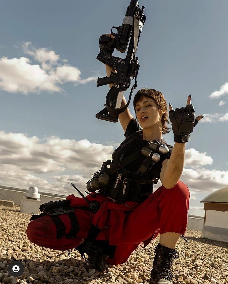 Money Heist Tokyo cosplay with tactical gear and rifle on a rooftop HD phone wallpaper