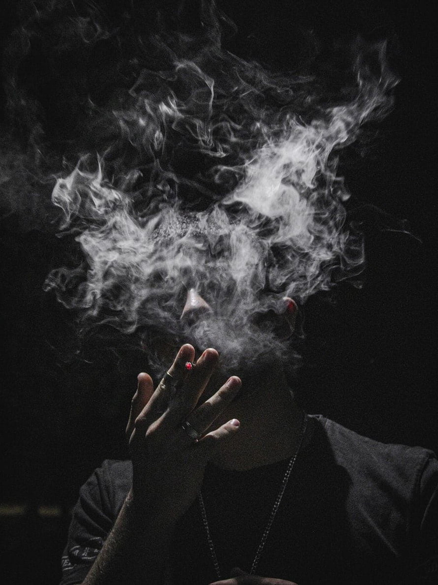 Moody Portrait of a Young Man Exhaling Thick Smoke Against a Dark Background, Smoking Boy, cigarette boy HD phone wallpaper