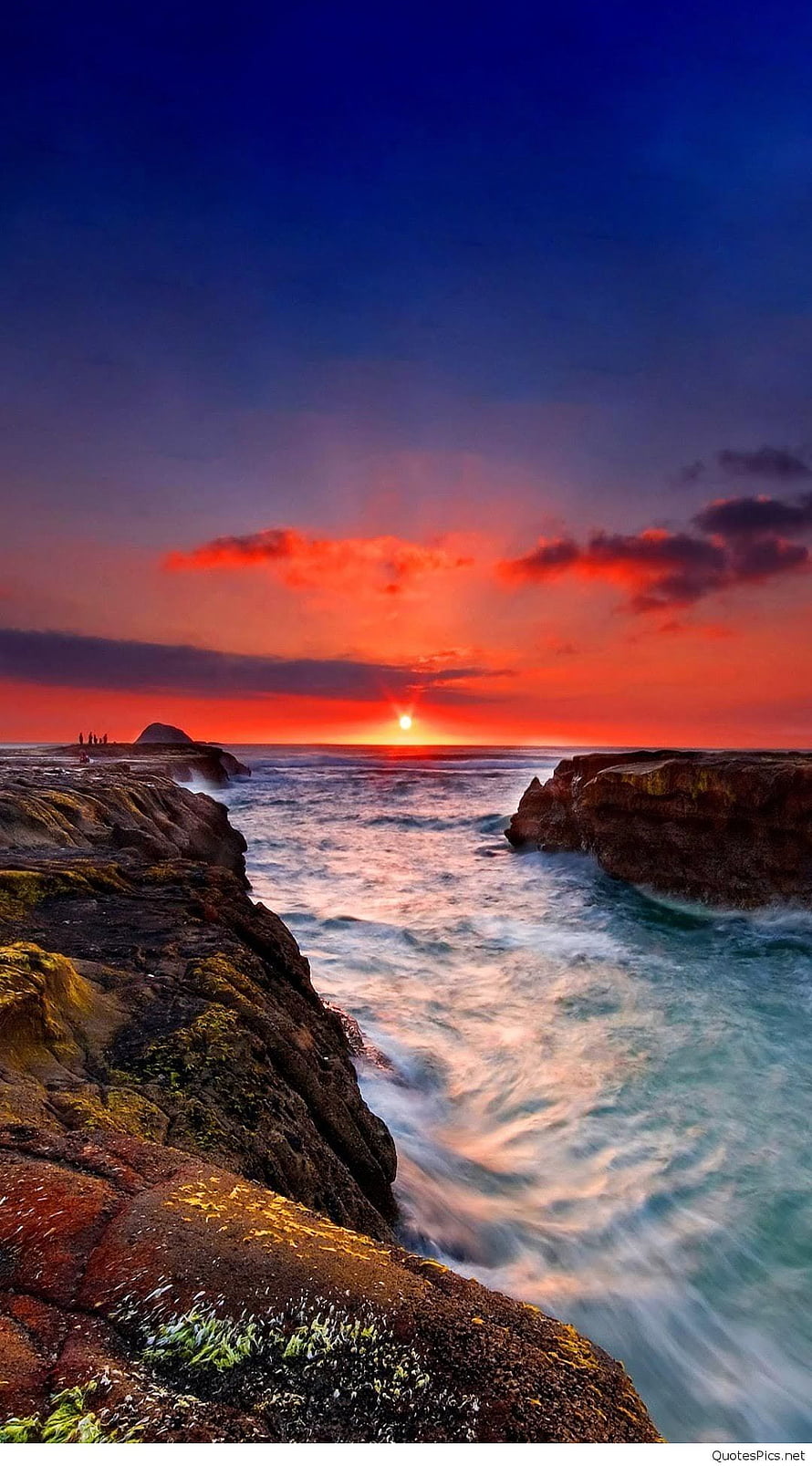 Dramatic Ocean Sunset Over Rugged Coastal Rocks and Turquoise Waves HD phone wallpaper