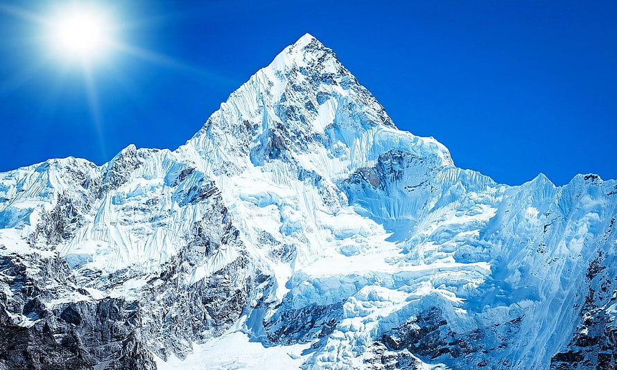 Majestic Snow-Capped Peak of Mount Everest Under a Clear Blue Sky HD wallpaper