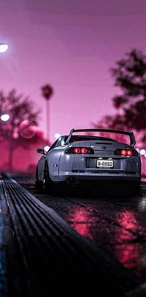 Silver Toyota Supra Rear View on Wet Night Street with Neon Pink Sky HD phone wallpaper