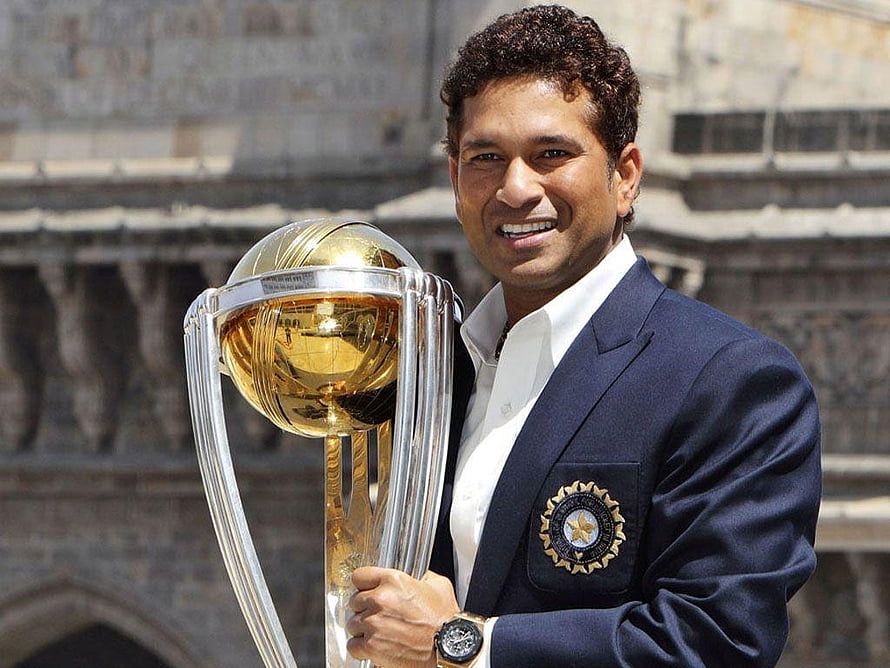 Sachin Tendulkar holding the ICC Cricket World Cup trophy in a blue blazer HD wallpaper
