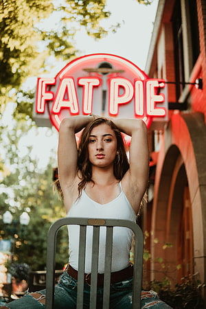 Young Woman in White Tank Top Sitting on Chair in Front of Fat Pie Neon Sign, 50 Armpit [], women armpit HD phone wallpaper