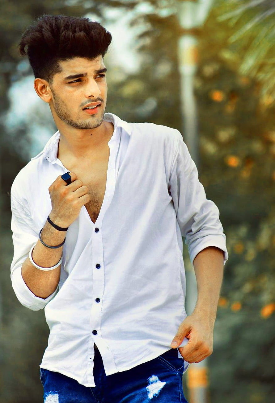 Young man in open white shirt and distressed denim jeans posing outdoors, Stylish Boy Whatsapp Dp Pic HD phone wallpaper
