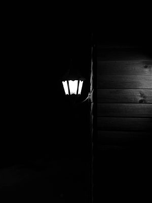 Glowing Lantern on Dark Wooden Wall at Night HD phone wallpaper