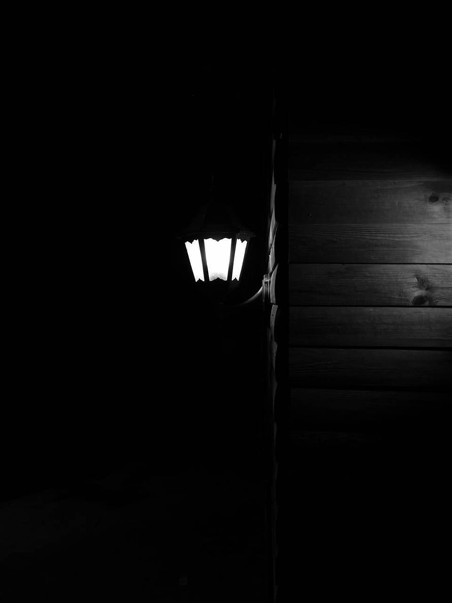Glowing Lantern on Dark Wooden Wall at Night HD phone wallpaper
