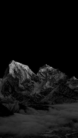 Dramatic Black and White Mountain Peaks Rising Above Clouds HD phone wallpaper
