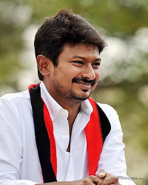 Udhayanidhi Stalin smiling portrait in white shirt with red and black scarf HD phone wallpaper