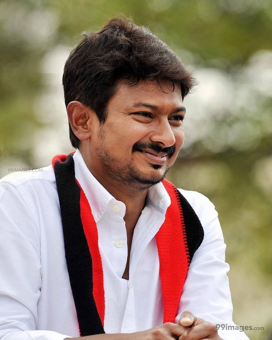 Udhayanidhi Stalin smiling portrait in white shirt with red and black scarf HD phone wallpaper