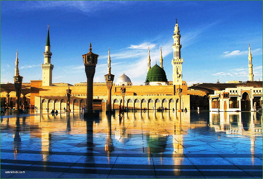 Al-Masjid an-Nabawi in Medina with the Green Dome and Minarets Reflected on Polished Marble Courtyard HD wallpaper
