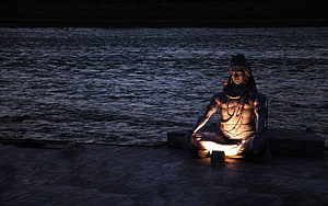 Statue of Lord Shiva Meditating by the River at Night HD wallpaper