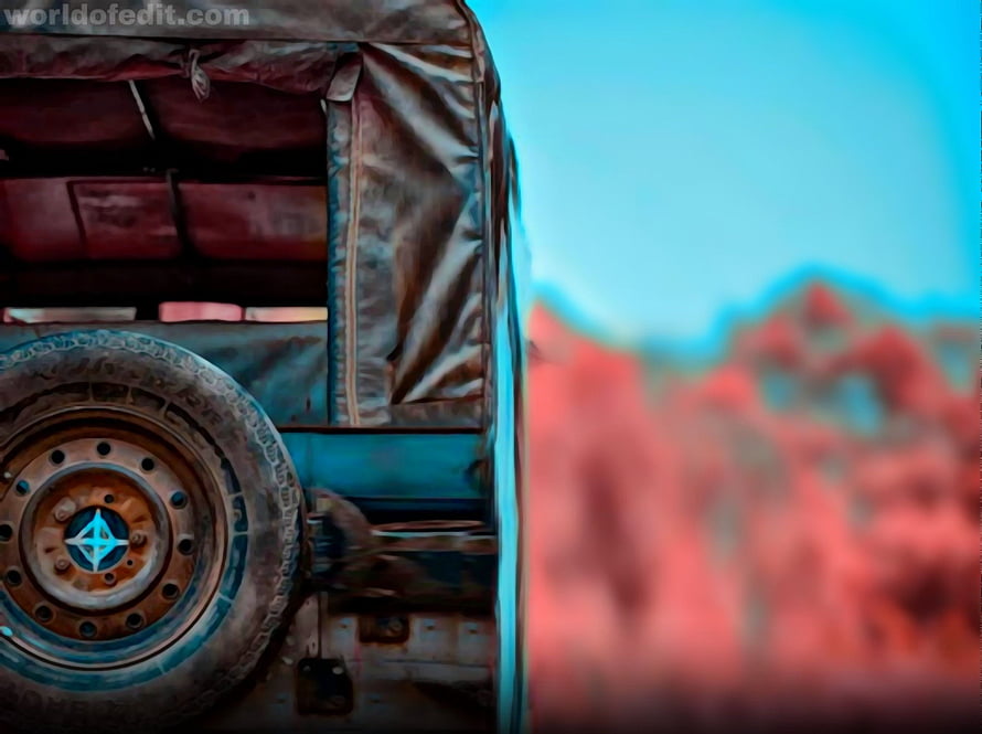 Rusty Vintage Truck Wheel with Canvas Cover Against Blurred Red Landscape HD wallpaper