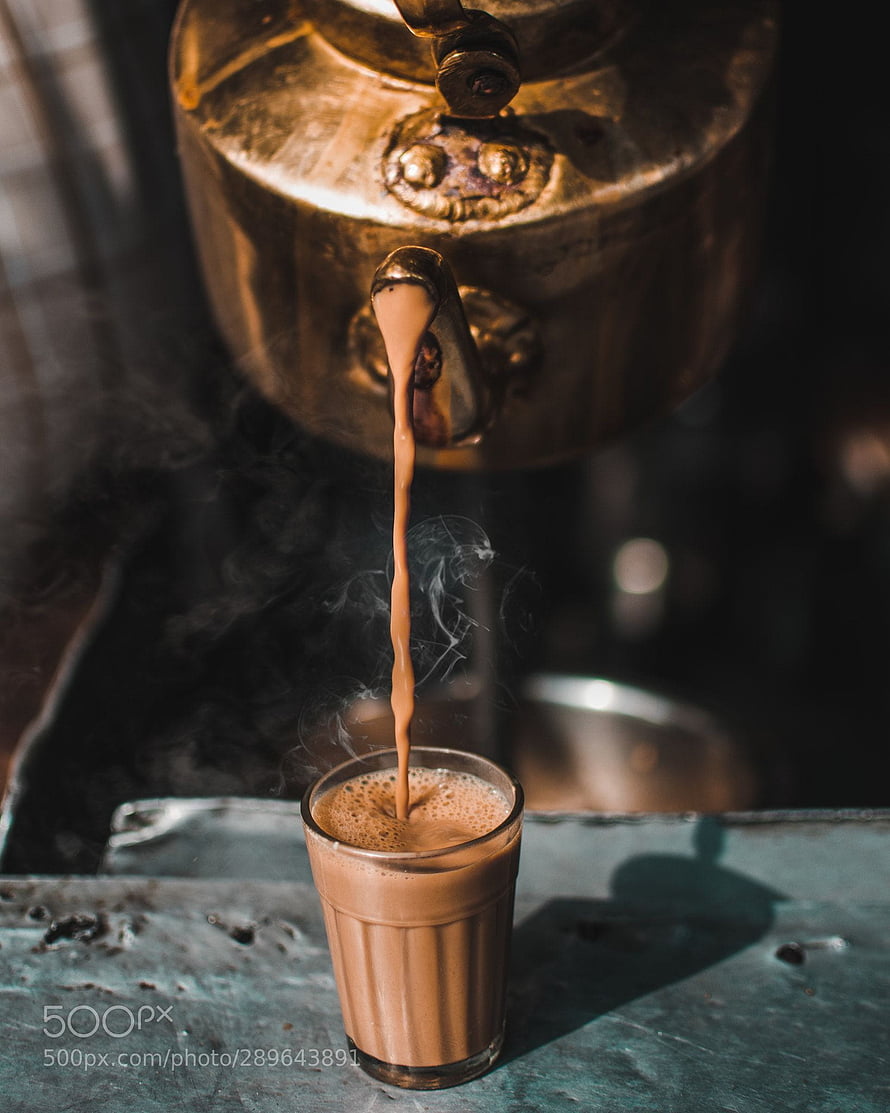Hot Masala Chai Pouring From Traditional Brass Kettle Into Glass HD phone wallpaper