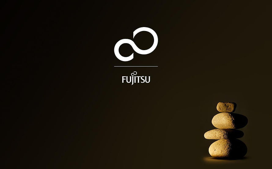 Fujitsu Infinity Logo with Balanced Zen Stones on Dark Background HD wallpaper