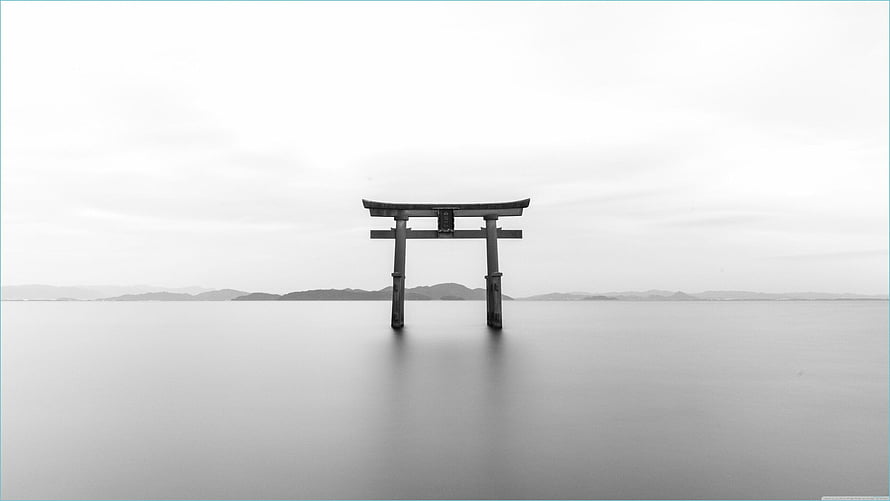Serene Black And White Torii Gate Standing In Calm Water With Distant Mountains HD wallpaper