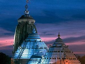 Jagannath Temple Puri at Dusk with Illuminated Shikharas and Twilight Sky HD wallpaper