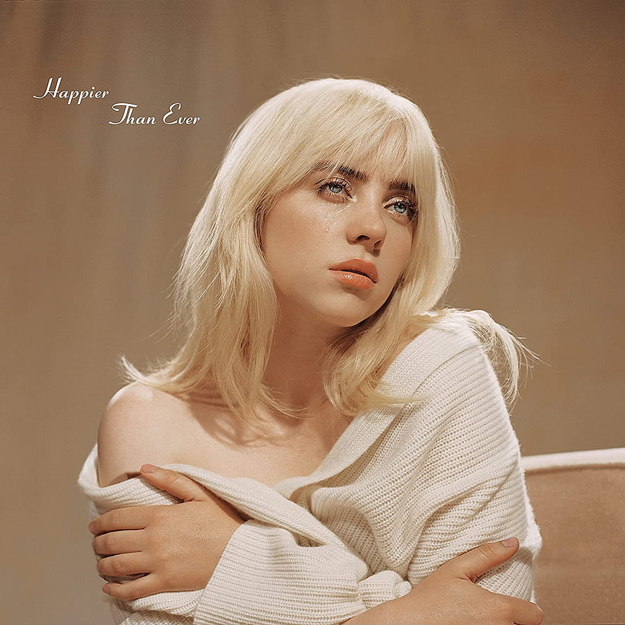 Billie Eilish in a cream knit sweater with platinum blonde hair and a contemplative expression HD phone wallpaper