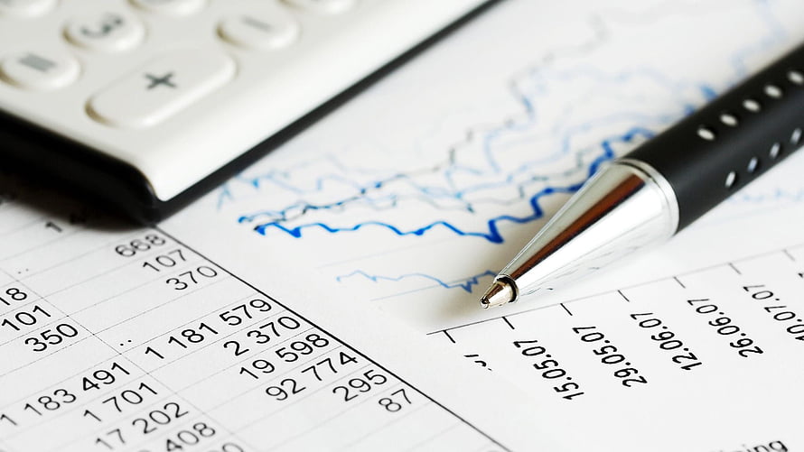 Financial Planning Workspace with Calculator, Pen, and Data Charts HD wallpaper